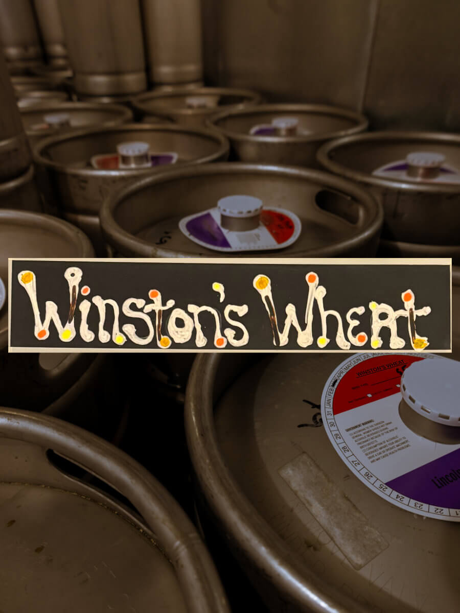 Kegs full of a Witbier beer named Winston’s Wheat.